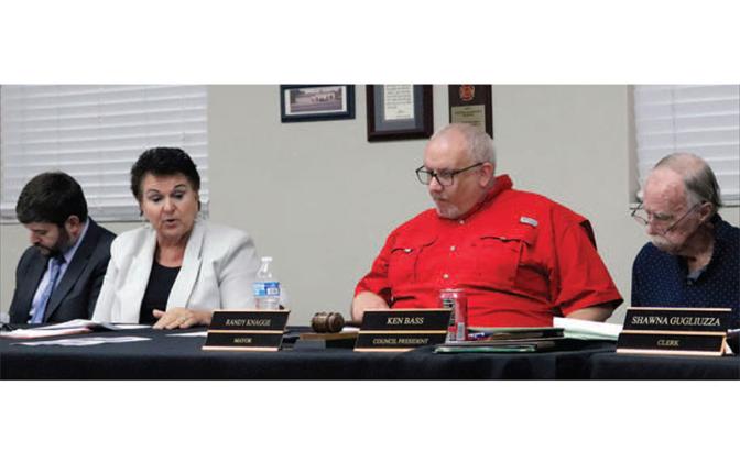 Nassau County School Board Attorney Brett Steger, Superintendent Kathy Burns, Callahan Mayor Randy Knagge and Callahan Town Council President Ken Bass are among those in attendance at a workshop in Callahan Monday night. Photo by Kathie Sciullo/CNI Newspapers