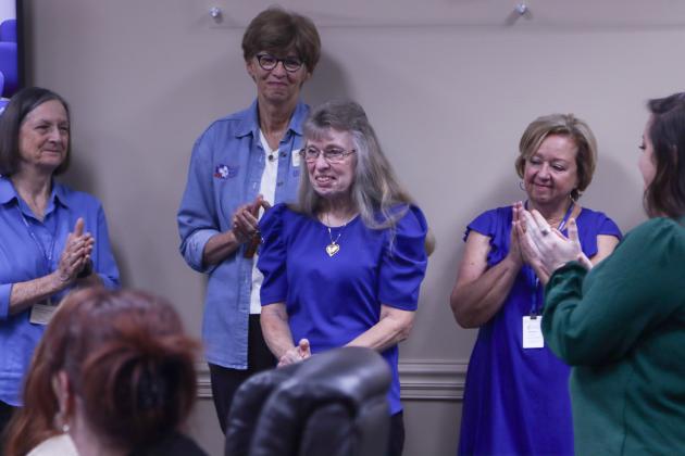 Wanda Simmons receives a standing ovation Wednesday morning at the Nassau County Board of County Commissioners meeting. She was surprised at the meeting with the announcement of her induction into the Florida 4-H Hall of Fame for her 33 years of service. Photo by Ashley Chandler/News-Leader