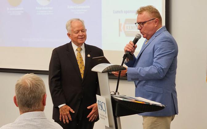 NCEDB Chair Paul Schwend, right, recognized retiring Nassau County Clerk of the Courts John A. Crawford at the recent economic update luncheon for his years of service and contributions. Photo by Foy Maloy/News-Leader