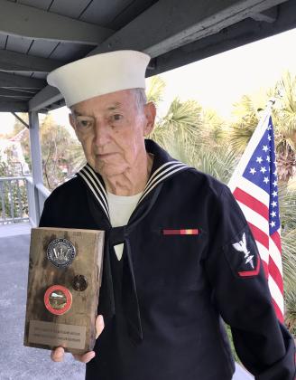 It still fits. Roberts models his old Navy uniform. Photo by Pamela Bushnell/News-Leader
