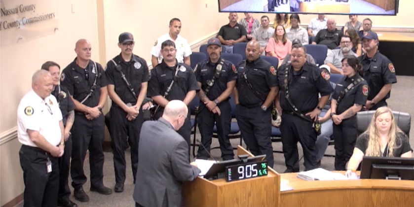 Emergency workers listen on May 15 as Chairman John Martin reads the proclamation declaring May 19-25 as Emergency Medical Workers Week at the Nassau County Board of County Commissioners. Submitted