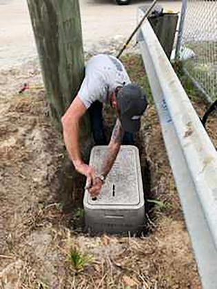 James (JD) Morgan, Nassau County electrician, works on a Quazite box. Before Morgan worked for the county, he worked as a lineman on overhead power lines. A work accident ended his line career and started a life-changing journey, which lead him to being a Nassau County Employee of the Quarter this year. Submitted