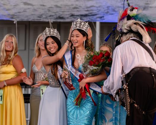 Miss Shrimp Festival 2023, Tristny Ta, crowns her sister, Jenny Ta, as Miss Shrimp Festival 2024. Photo by Penny Glackin/Special