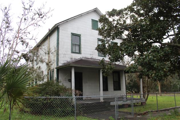 The property, located on Third and Fourth streets, currently has four single-family homes and accessory structures that were built by the Tringali family. Photo by Julia Roberts/News-Leader