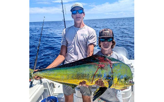 Carter Pickett, left, and Bryce Jordan are pictured with two nice dolphin while bluewater fishing out of the St. Augustine inlet. Alex-ander Roberts was also on board and caught and released a sailfish.
