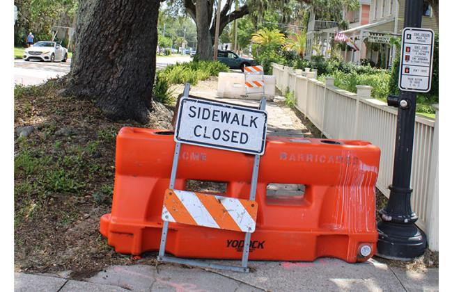 The sidewalk in front of the Hoyt House bed and breakfast is being damaged by the roots of a tree and has been closed by the Florida Department of Transportation. The department plans to remove the hexagonal pavers that make up the sidewalk and replace them with concrete, while local residents want the pavers to be preserved. Photo by Julia Roberts/News-Leader