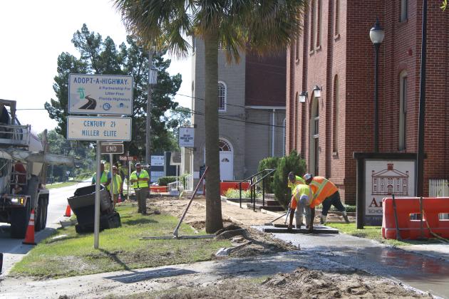 Crews laid concrete to replace the hexagonal paver sidewalk on Atlantic Avenue in Fernandina Beach. Photo by Julia Roberts/News-Leader