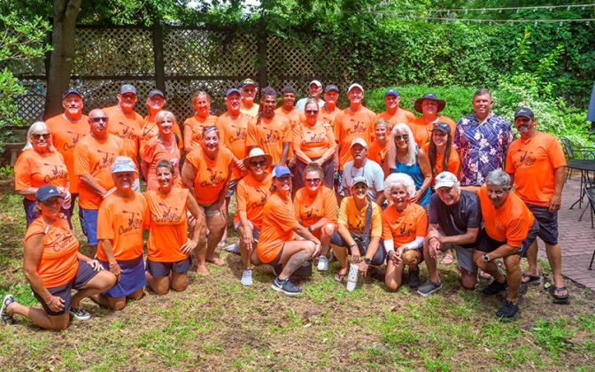 Volunteers pose for a photo Saturday at the Cross the Line Paddle for Veterans event. Photos by Mariah Lovin/The Barefoot Photographer