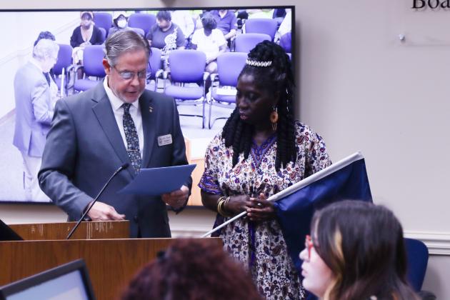 Commissioner A.M. “Hupp” Huppmann, left, reads a proclamation as Chieftess of the Gullah-Geechee Nation Queen Quet follows along. Nassau County proclaimed July 27-Aug. 4 as Gullah-Geechee Nation Appreciation Week in the county at the Nassau County Board of County Commissioners Wednesday meeting.  Photo by Ashley Chandler/News-Leader