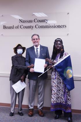 From left, Gullah-Geechee elder Gloria Jean Thomas, Commissioner A.M. “Hupp” Huppmann and Queen Quet, Chieftess of the Gullah-Geechee Nation, pose with the Nassau County proclamation naming July 27-Aug. 4 as Gullah-Geechee Nation Appreciation Week in the county. Photo by Ashley Chandler/News-Leader