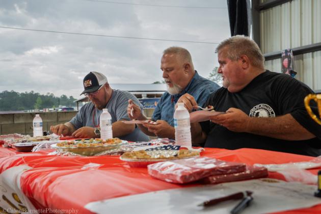From left, Nassau County Commissioner Klynt Farmer, Callahan Mayor Randy Knagge and Hilliard Mayor John Beasley taste test the pies during the Pie Baking Contest at The 2024 Light Up The Sky Independence Day Celebration. Photo courtesy of Calen Burnette/Calen Burnette Photography