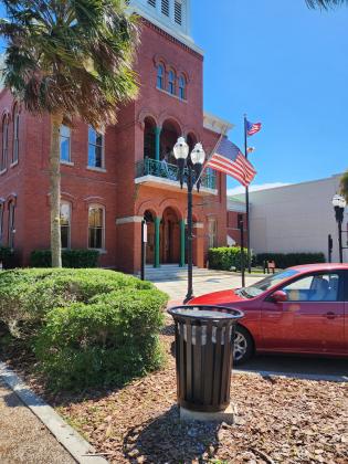 A temporary art installation was once on this pedestal in front of the courthouse on Centre Street. The base now homes a trash can. Nassau Council of Arts and Culture President Richard Restiano worked with the artist to bring the piece to the city. NCAC wants to work with the city on its Arts in Public Places program, which the city is considering placing under the direction of Parks and Recreation. Photo courtesy NCAC