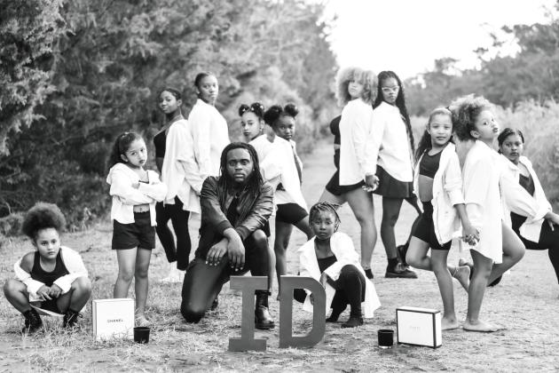 Infamous Dance gives local youths a chance to create community while learning dance. Pictured is Coach T (Tayren Way) with Gianna Wright, Talayah Shelby, Irie Roberson, Sarah Roberson, Kawaii Mitchell, Cassidy Bell, Ji’love Hopkins, Jamaya Goodwin, Hadleigh White, Jayla Washington and Dariona Terrell.  Photo courtesy of Infamous Dance