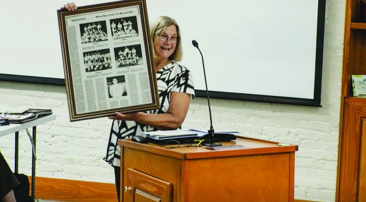 Linda Velardi Trump, the daughter of Joe Velardi, who headed the effort to bring Little League to Fernandina Beach in the 1950s, shares some of the history of the field that is named for her father. She brought a framed story, which ran in the News-Leader in the 1970s, about her father to city hall, and said the field should remain a softball and baseball field. The community, and the city commission, agreed. Submitted photo