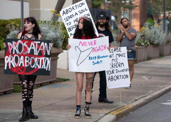 Demonstrators gather outside the Winston Arnow Federal Building in downtown Pensacola on  May 3, 2022. The protest was called after a leaked U.S. Supreme Court opinion indicated the court will rule in favor of overturning Roe versus Wade and clear the path for states to make abortion illegal. Tony Giberson/News Service of Florida