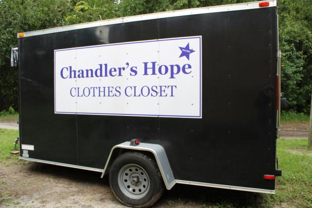 The charity accepts donated clothing for men, women and children at their local warehouse. Items are then taken in a trailer to various sites in the community for people to shop for their needs.  Photo by Pamela Bushness/News-Leader