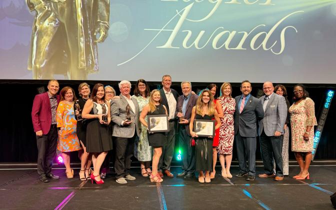 Staff and representatives of the Amelia Island Convention &amp; Visitor's Bureau (CVB), Nassau County and Amelia Island Tourist Development Council pose with the CVB's Flagler Awards at the 2024 Flagler Awards ceremony held at the 2024 Florida Governor’s Conference on Tourism, Aug. 28-30 in Tampa. Submitted photo
