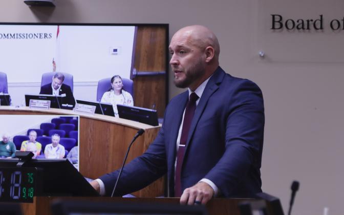 County Manager Taco Pope speaks Wednesday at the Board of County Commissioners meeting. Photo by Ashley Chandler/News-Leader