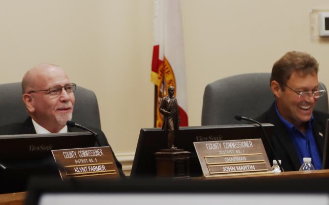 A Flagler Award sits on the commissioners desk Monday in front of commissioners John Martin, left and Jeff Gray, at the Nassau County Board of County Commissioners meeting. Martin was in attendance at the Flagler Awards. Ashley Chandler/News-Leader