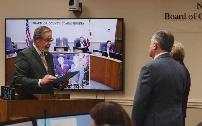 Commissioner A.M. "Hupp" Huppmann reads the proclamation declaring October 2024 as Emily Adkins Blood Clot Awareness Month in Nassau County at the Oct. 16 Board of County Commissioners meeting. Photo by Ashley Chandler/News-Leader