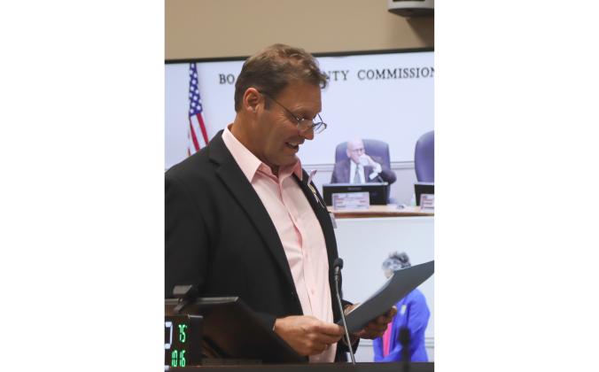 Commissioner Jeff Gray reads the proclamation dedicating the week of Oct. 25 through Nov. 2 as Mobility Week at the Oct. 16 at the Board of County Commissioners meeting. Photo by Ashley Chandler/News-Leader