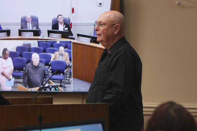 Breast Cancer Survivor Jose Garcia speaks on Oct. 16 at the Board of County Commissioners meeting after receiving a proclamation from the board declaring the week of Oct 20 - 26 as Breast Cancer Awareness Week in the county, and today as Pink Day. Garcia is the first man to receive the proclamation from the county. Photo by Ashley Chandler/News-Leader