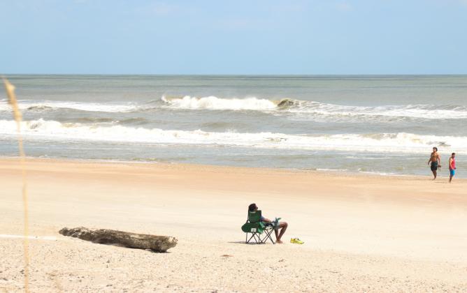 Visitors on American Beach midday Friday. County workers had the majority of debris cleaned up and beach driving already had reopened by midday Friday. Hurricane Helene blew through only hours before. Photo by Ashley Chandler/News-Leader