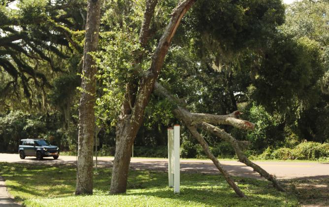 Nassau County workers had the majority of debris cleaned off the roads by midday Friday but brush and debris could be still be seen and and some private property damage remained. Hurricane Helene blew through only hours before. Photo by Ashley Chandler/News-Leader