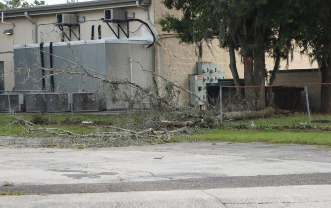 Nassau County workers had the majority of debris cleaned off the roads by midday Friday but brush and debris could still be seen and and some private property damage remained. Hurricane Helene blew through only hours earlier. Photo by Ashley Chandler/News-Leader