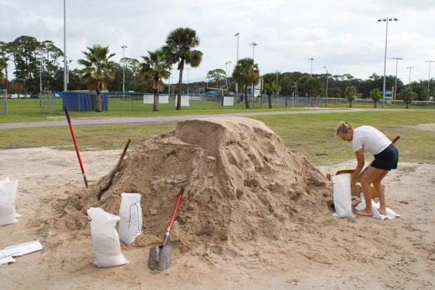 Melissa Hall filled up sandbags in advance of Hurricane Milton. She said she has lived on Amelia Island since 1993, and her home was flooded during recent heavy rains, and she wants to be prepared for Milton. Photo by Julia Roberts/News-Leader