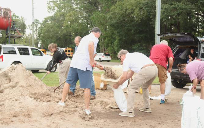 Locals prepare for Hurricane Milton by filling sandbags Monday at Yulee Ballpark. Photo by Ashley Chandler/News-Leader