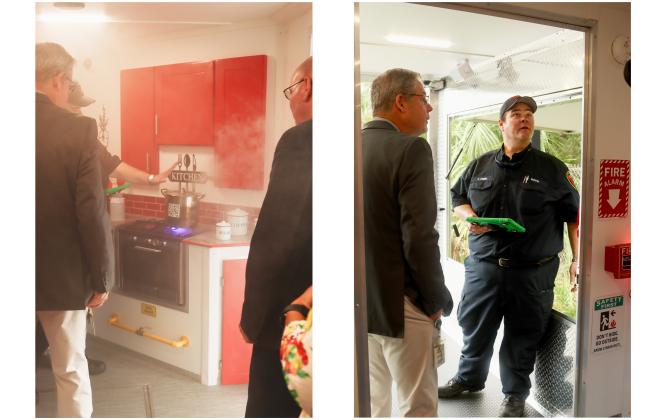 Left: Thomas Ford, fire inspector for Nassau County Fire Rescue, shows Nassau County commissioners around the new city/county Safety Education Trailer. Right: Thomas Ford, fire inspector for Nassau County Fire Rescue, right, shows Commissioner A.M. "Hupp" Huppmann around the new city/county Fire Safety Trailer. Photos by Ashley Chandler