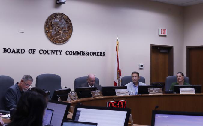 From left, commissioners A.M. "Hupp" Huppmann, John Martin, Jeff Gray and Alyson McCullough meet Wednesday for the Board of County Commissioners meeting in the Commission Chambers. Commissioner Klynt Farmer was absent from votes this week. Ashley Chandler/News-Leader