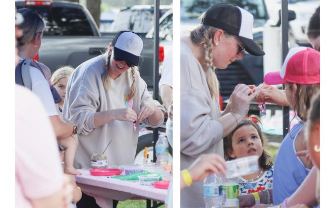 Stephanie Tomberline, Addy's mom, makes crafts with visitors of Addyfest on Monday at Central Park. Photos by Ashley Chandler/News-Leader