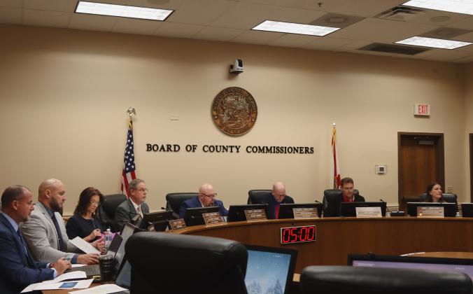 County commissioners and staff meet Wednesday in the Commission Chambers for the last Board of County Commissioners meeting of the year. From left, Assistant County Manager Marshall Eyerman, County Manager Taco Pope, County Attorney Denise May, commissioners A.M. "Hupp" Huppmann, Klynt Farmer, John Martin, Jeff Gray and Alyson McCullough. Photos by Ashley Chandler/News-Leader