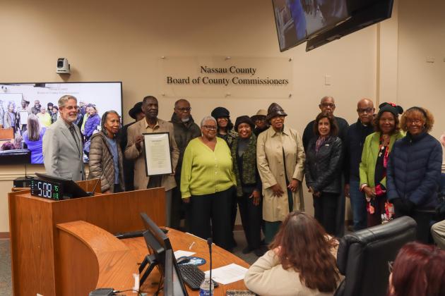 Commissioner A.M. "Hupp" Huppmann and the Board of County Commissioner presented a proclamation to American Beach residents on Jan. 13 declaring Jan. 31 as American Beach Day and recognizing the historic district's 90th anniversary. Photo by Ashley Chandler/News-Leader
