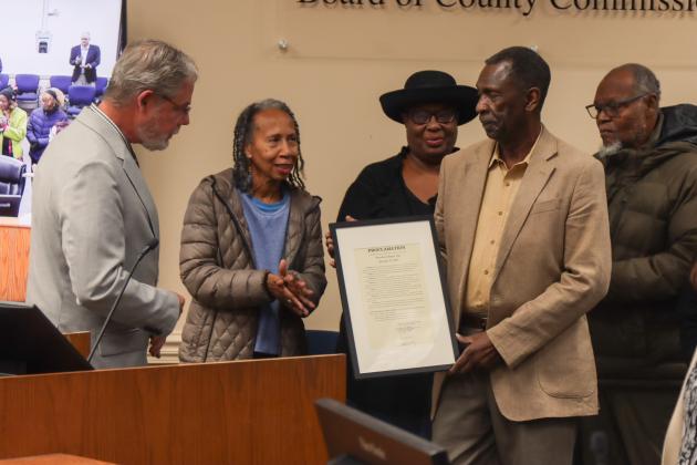 Commissioner A.M. "Hupp" Huppmann and the Board of County Commissioner presented a proclamation to American Beach residents on Jan. 13 declaring Jan. 31 as American Beach Day and recognizing the historic district's 90th anniversary. From left: Huppmann, Beverly Davis, Carolyn Jones, Erving Gilyard and Joe Hayman. Photo by Ashley Chandler/News-Leader