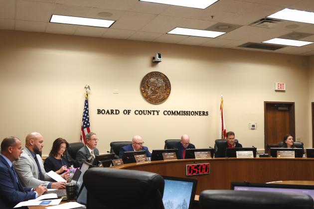 County staff and commissioner meet for the final meeting of 2024. From left, Assistant County Manager Marshall Eyerman, County Manager Taco Pope, County Attorney Denise May, commissioners A.M. "Hupp" Huppmann, Klynt Farmer, John Martin, Jeff Gray and Alyson McCullough. Photo by Ashley Chandler/News-Leader