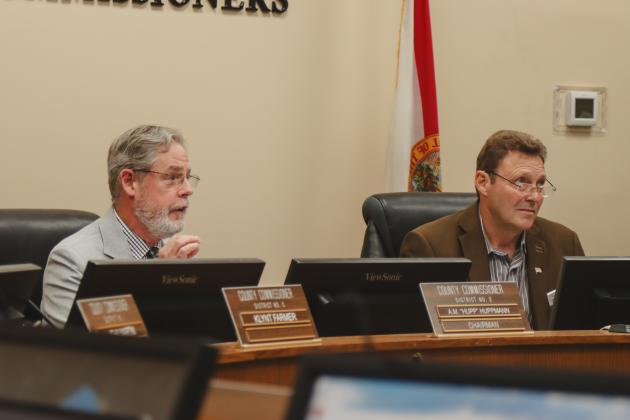 Chairman A.M. "Hupp" Huppmann and Vice-Chairman Jeff Gray attend the first Board of County Commissioners meeting of the year Monday. It was the first meeting the two lead the board in proceedings. Photo by Ashley Chandler/News-Leader