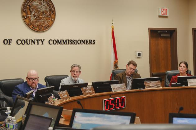 From left, commissioners Klynt Farmer, A.M. "Hupp" Huppmann, Jeff Gray and Alyson McCullough attend the first Board of County Commissioners meeting of the year Monday. Photo by Ashley Chandler/News-Leader