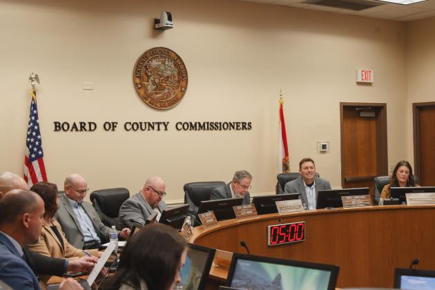 From left, commissioners John Martin, Klynt Farmer, A.M. "Hupp" Huppmann, Jeff Gray and Alyson McCullough work in the Commission Chambers during the Board of County Commissioners regular Wednesday morning meeting. Photo by Ashley Chandler/News-Leader