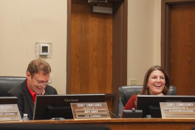 Commissioner Jeff Gray and Alyson McCullough react during Monday’s Board of County Commissioner meeting. Photo by Ashley Chandler/News-Leader