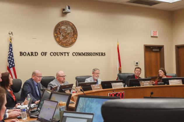 The Board of County Commissioners navigate a new computer program it will be using going forward at meetings. From left: County Attorney Denise May, commissioners John Martin, Klynt Farmer, A.M. “Hupp” Huppmann, Jeff Gray and Alyson McCullough. Photo by Ashley Chandler/News-Leader
