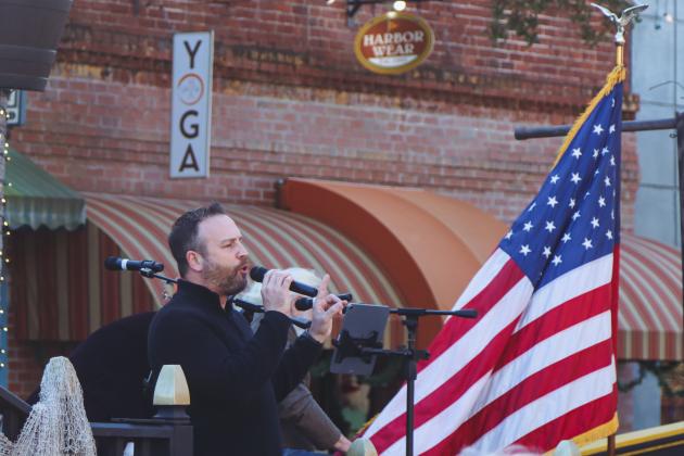 OHPA Commissioner Justin Taylor speaks at Dining Down Centre, a celebration for Fernandina's Bicentennial. Photo by Ashley Chandler/News-Leader