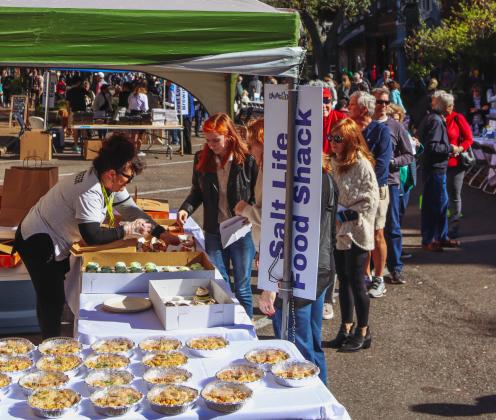 Dining Down Centre was held Wednesday on Centre Street to celebrate Fernandina's 200th birthday. Those who bought tickets we provided with a meal from one of the participating restaurants, such as these from Salt Life Food Shack. Photo by Ashley Chandler/News-Leader