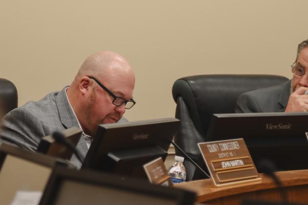 Commissioner Klynt Farmer reads a statement he prepared in response to a statement made Monday by Commissioner Alyson McCullough that claimed the board showed bias in passing her by for a vice-chair nomination. Commissioners confirmed McCullough's comments were directed at Farmer. Photo by Ashley Chandler/News-Leader