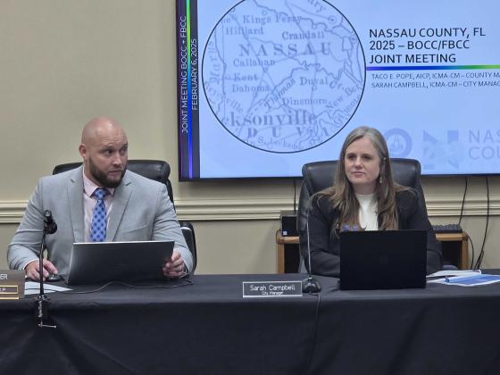 County Manager Taco Pope, left, and City Manager Sarah Campbell at the joint meeting between the Fernandina Beach City Commission and the Nassau County Board of County Commissioners on Thursday at the James S. Page Governmental Complex. Photo by Julia Roberts/News-Leader