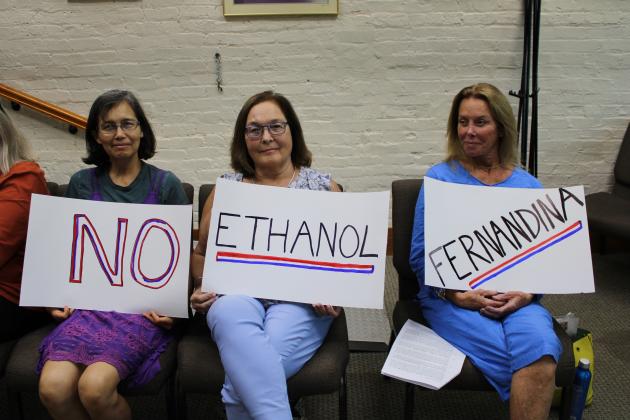 No Ethanol Fernandina group photo Elsa Liebenberg, Sandra Carey and Bryn Byron began protesting a bioethanol plant proposed for RYAM’s Fernandina Beach campus last year. This week, Fernandina Beach City Manager Sarah Campbell ruled the plant cannot be allowed under the city’s Land Development Code and Comprehensive Plan. RYAM has 30 days to appeal that decision. Photo by Julia Roberts/News-Leader