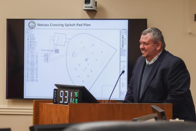 Deputy County Manager Robert Companion talks about the Nassau Crossing Park Splash Pad on Wednesday at the Board of County Commissioners meeting. The board approved an amendment to a contract with ACON Construction Co. to cover the rest of the cost of design and construction of the Splash Pad, expected to be completed by summer. Photo by Ashley Chandler/News-Leader