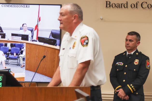 James Graf, right, was recognized at the Feb. 19 Board of County Commissioners meeting for his 25 years of service with Fire-Rescue. Left, Fire Chief Brady Rigdon. Photo by Ashley Chandler/News-Leader
